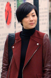 梁美行